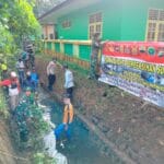 Satgas TMMD Ke-124 Kodim 0315/TPI: Harmoni TNI, Polri, dan Warga Satgas TMMD Ke-124 Kodim 0315/TPI: Harmoni TNI, Polri, dan Warga dalam Menjaga Lingkungan di Lingga